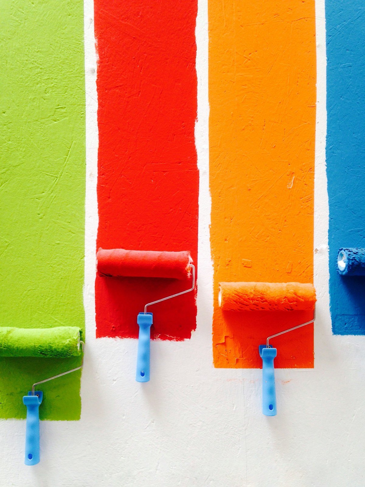 Paint rollers showing a range of color options