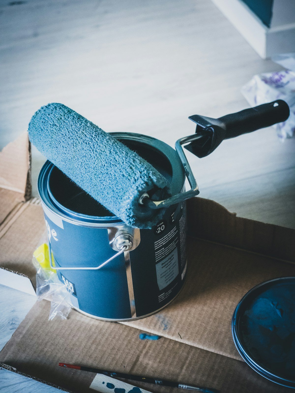 Paint roller and materials prepared for an interior painting project